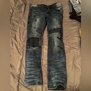 Men’s distressed, blue jeans